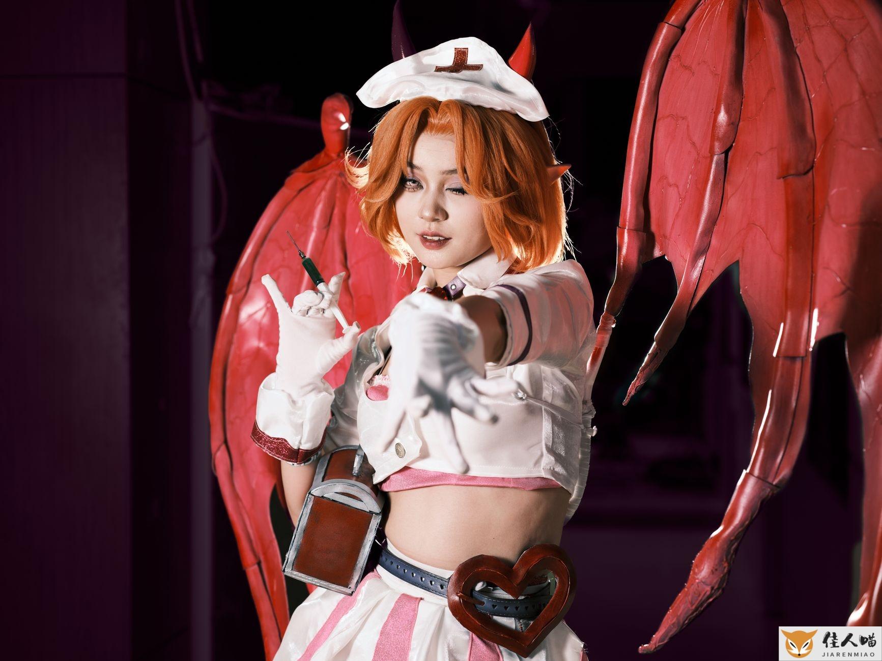 Cosplayer in a demon-themed costume with red wings, posing dramatically. Perfect for fantasy and cosplay themes.