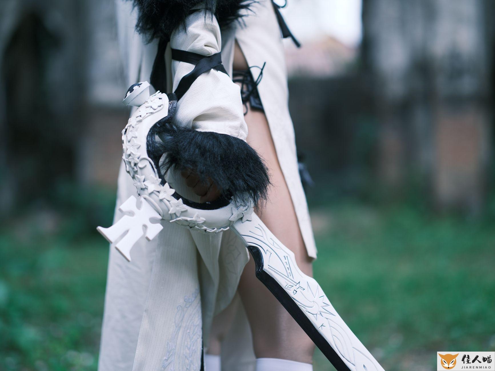 Close-up of a person in medieval cosplay costume holding a detailed fantasy sword outdoors.