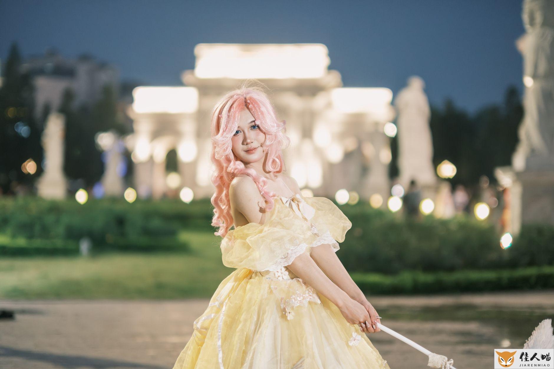 A person in a detailed cosplay costume posing in an illuminated outdoor setting.
